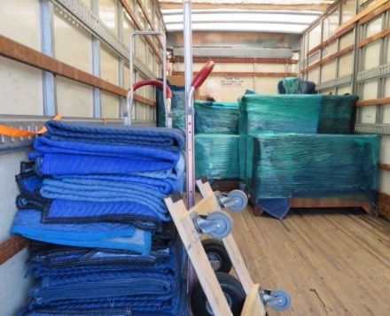 BLANKETS, PADS, STRAPS IN MOVING TRUCK FOR BLANKET WRAP MOVING AND LOCAL PICKUP AND DELIVERY